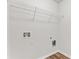 Unfinished laundry room with plumbing hookups and a wire shelf at 1931 Old Dogwood, Jonesboro, GA 30238