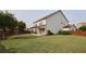 Expansive backyard with lush green grass, fenced-in area, patio, and swing set for outdoor enjoyment at 2029 Havenhurst Way, Auburn, GA 30011