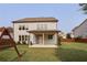 Large, well-maintained backyard featuring a covered patio and ample green space at 2029 Havenhurst Way, Auburn, GA 30011