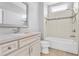 Clean bathroom featuring a tub and shower combination with tiled backsplash at 2029 Havenhurst Way, Auburn, GA 30011
