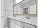 Modern bathroom boasts double sinks, quartz countertops, brushed gold faucets, and ample cabinet space at 2029 Havenhurst Way, Auburn, GA 30011