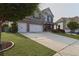 Attractive two-story home with a two-car garage, brick facade, and a driveway that runs the length of the home at 2029 Havenhurst Way, Auburn, GA 30011