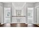 Upstairs hallway featuring views into bedrooms, with a decorative hanging light at 2029 Havenhurst Way, Auburn, GA 30011