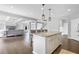 Spacious open concept kitchen, seamlessly blending into the dining area and living room at 2029 Havenhurst Way, Auburn, GA 30011