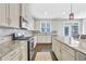 Bright modern kitchen with granite counters, stainless appliances and tile backsplash at 2029 Havenhurst Way, Auburn, GA 30011