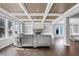 Spacious living room featuring hardwood floors, coffered ceiling and fireplace with built in shelving at 2029 Havenhurst Way, Auburn, GA 30011