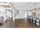 Open concept living room with seamless transition to kitchen and hardwood flooring throughout at 2029 Havenhurst Way, Auburn, GA 30011