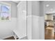 Charming mudroom area featuring board and batten wall paneling, built-in bench seating and hooks at 2029 Havenhurst Way, Auburn, GA 30011