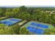 Community tennis courts surrounded by lush trees, perfect for active living at 2029 Havenhurst Way, Auburn, GA 30011