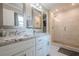 Beautiful bathroom with double sinks, granite countertops, and large glass shower at 205 Plantation Sw Rd, Smyrna, GA 30082