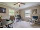 Comfortable bedroom with two desks, neutral walls and a ceiling fan at 205 Plantation Sw Rd, Smyrna, GA 30082