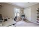 Bright bedroom with desk, neutral walls and shelving. Comfy chair and window at 205 Plantation Sw Rd, Smyrna, GA 30082
