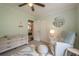 Bright Bedroom with closet space, soft carpeting and a plush glider chair at 205 Plantation Sw Rd, Smyrna, GA 30082