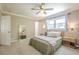 Spacious bedroom with natural lighting, hardwood furniture, and a ceiling fan at 205 Plantation Sw Rd, Smyrna, GA 30082