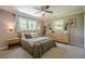 Bedroom with natural light, two windows, modern furniture, and a ceiling fan at 205 Plantation Sw Rd, Smyrna, GA 30082