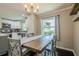 Dining area with wood table and view into the kitchen area and stainless steel appliances at 205 Plantation Sw Rd, Smyrna, GA 30082