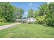 Charming two-story home with a welcoming carport and nicely landscaped front yard at 205 Plantation Sw Rd, Smyrna, GA 30082