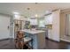 Modern kitchen featuring stainless steel appliances, granite countertops, and a center island with seating, perfect for culinary enthusiasts at 205 Plantation Sw Rd, Smyrna, GA 30082