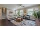 Inviting living room showcasing stylish furnishings, natural light, and beautiful hardwood floors, creating a comfortable atmosphere at 205 Plantation Sw Rd, Smyrna, GA 30082