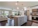 Open concept living room and kitchen with modern furniture and a center island at 205 Plantation Sw Rd, Smyrna, GA 30082