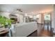 Open-concept living room featuring a modern kitchen, cozy seating, and stylish décor, perfect for relaxation and entertaining at 205 Plantation Sw Rd, Smyrna, GA 30082