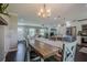 Open concept dining room, living room, and kitchen area with great natural lighting at 205 Plantation Sw Rd, Smyrna, GA 30082