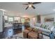 Open-concept living room featuring a modern kitchen, cozy seating, and stylish décor, perfect for relaxation and entertaining at 205 Plantation Sw Rd, Smyrna, GA 30082