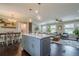 Open-concept living room featuring a modern kitchen, cozy seating, and stylish décor, perfect for relaxation and entertaining at 205 Plantation Sw Rd, Smyrna, GA 30082