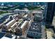 Aerial view of buildings in a commercial area with dense trees at 361 17Th St # 2120, Atlanta, GA 30363