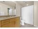Bathroom features a granite countertop sink, white cabinets, and tile flooring at 361 17Th St # 2120, Atlanta, GA 30363