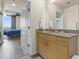 Bathroom featuring a granite countertop sink and a view into the main bedroom at 361 17Th St # 2120, Atlanta, GA 30363