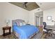 Cozy bedroom featuring a queen bed, desk, and a large rug, ceiling fan, and neutral walls at 361 17Th St # 2120, Atlanta, GA 30363