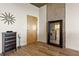 Entryway with wood flooring and a decorative mirror gives access to the kitchen and bathrooms at 361 17Th St # 2120, Atlanta, GA 30363