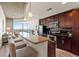 Modern kitchen with stainless steel appliances, granite countertops, and a breakfast bar overlooking the living area at 361 17Th St # 2120, Atlanta, GA 30363