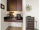 An elegant kitchenette features a floating countertop, undercabinet lighting, and additional overhead storage at 361 17Th St # 2120, Atlanta, GA 30363