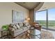 Bright and inviting living room with scenic views from the floor-to-ceiling window at 361 17Th St # 2120, Atlanta, GA 30363