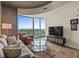 Open-concept living room with balcony access and comfortable seating at 361 17Th St # 2120, Atlanta, GA 30363