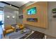 Comfortable lobby area with fireplace, decorative wood paneling, and modern furniture at 361 17Th St # 2120, Atlanta, GA 30363