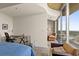 Main bedroom featuring a large balcony, desk and chair, and comfortable lounge seating at 361 17Th St # 2120, Atlanta, GA 30363
