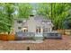 Expansive backyard with deck, stone patio, and lush greenery, perfect for outdoor living at 1183 Woods Ne Cir, Atlanta, GA 30324