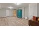 Spacious finished basement featuring modern flooring and storage, with closet and blue armoire at 1183 Woods Ne Cir, Atlanta, GA 30324