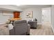 Finished basement with cozy seating area and an office area with a desk at 1183 Woods Ne Cir, Atlanta, GA 30324