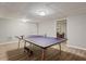 Finished basement game room featuring a ping pong table and modern art at 1183 Woods Ne Cir, Atlanta, GA 30324