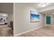 Finished basement hallway featuring modern art and vinyl plank flooring at 1183 Woods Ne Cir, Atlanta, GA 30324