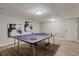 Finished basement game room featuring a ping pong table and modern art at 1183 Woods Ne Cir, Atlanta, GA 30324