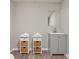 Modern bathroom featuring a gray vanity, open shelving, and a mirror at 1183 Woods Ne Cir, Atlanta, GA 30324
