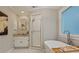 Elegant bathroom featuring a soaking tub, frameless shower, and vanity with granite countertop at 1183 Woods Ne Cir, Atlanta, GA 30324