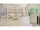 Upstairs bonus room with a tent, play area, and a view of a large window at 1183 Woods Ne Cir, Atlanta, GA 30324
