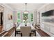 Spacious dining room with large windows and elegant chandelier, perfect for entertaining at 1183 Woods Ne Cir, Atlanta, GA 30324