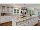 Updated kitchen boasts granite counters, stainless appliances and large island with a pot rack above at 1183 Woods Ne Cir, Atlanta, GA 30324